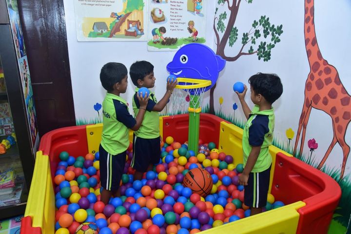 Children exploring the ball pit