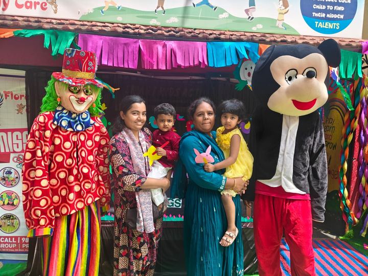 A clown and characters at a school celebration