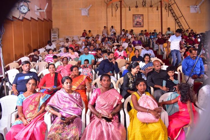 Families in the auditorium audience