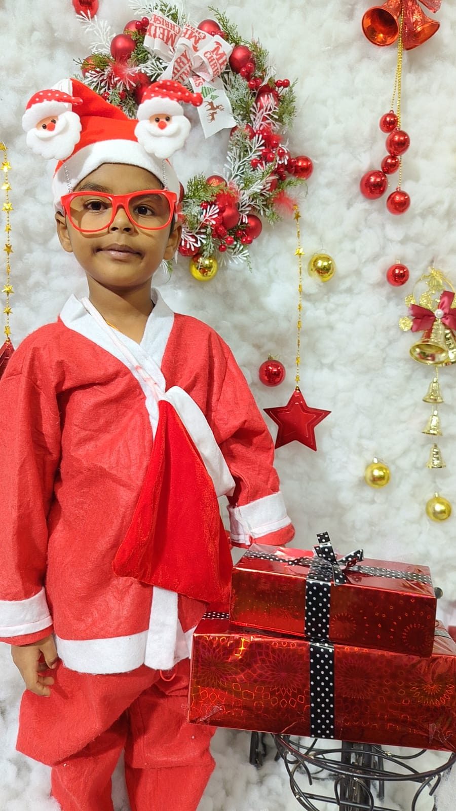 A child in a red Christmas outfit