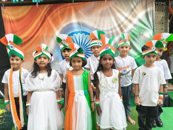 Children in tricolor outfits
