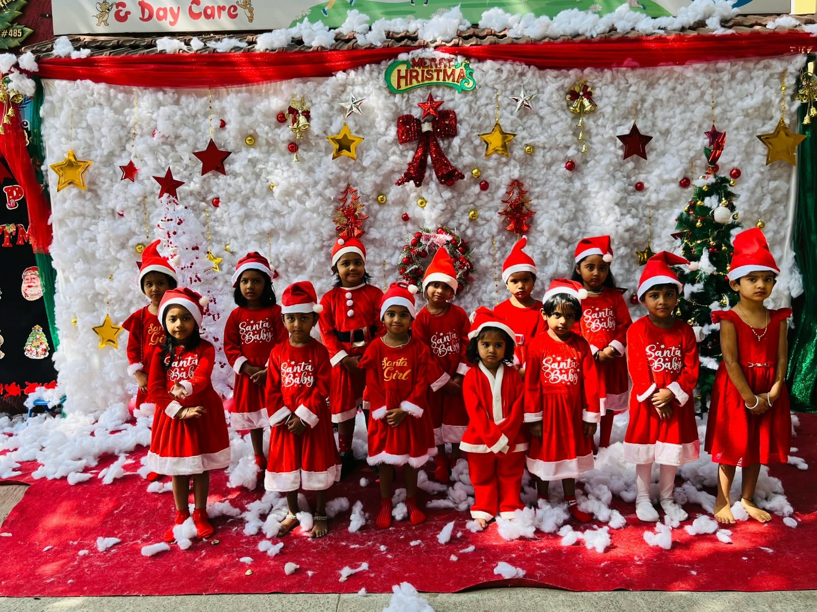 Children dressed in red at a Christmas celebration