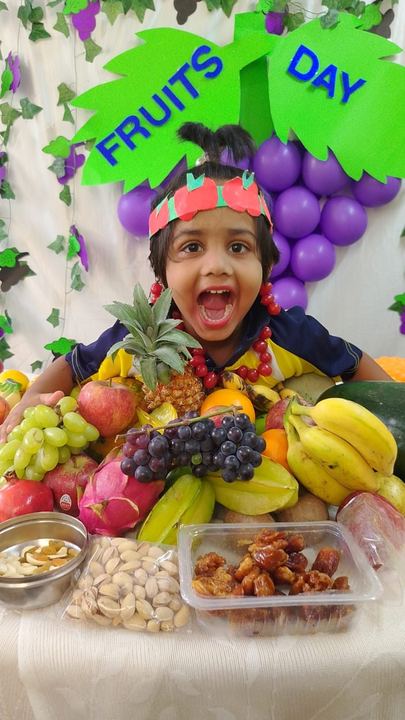 A child exploring a fruit display