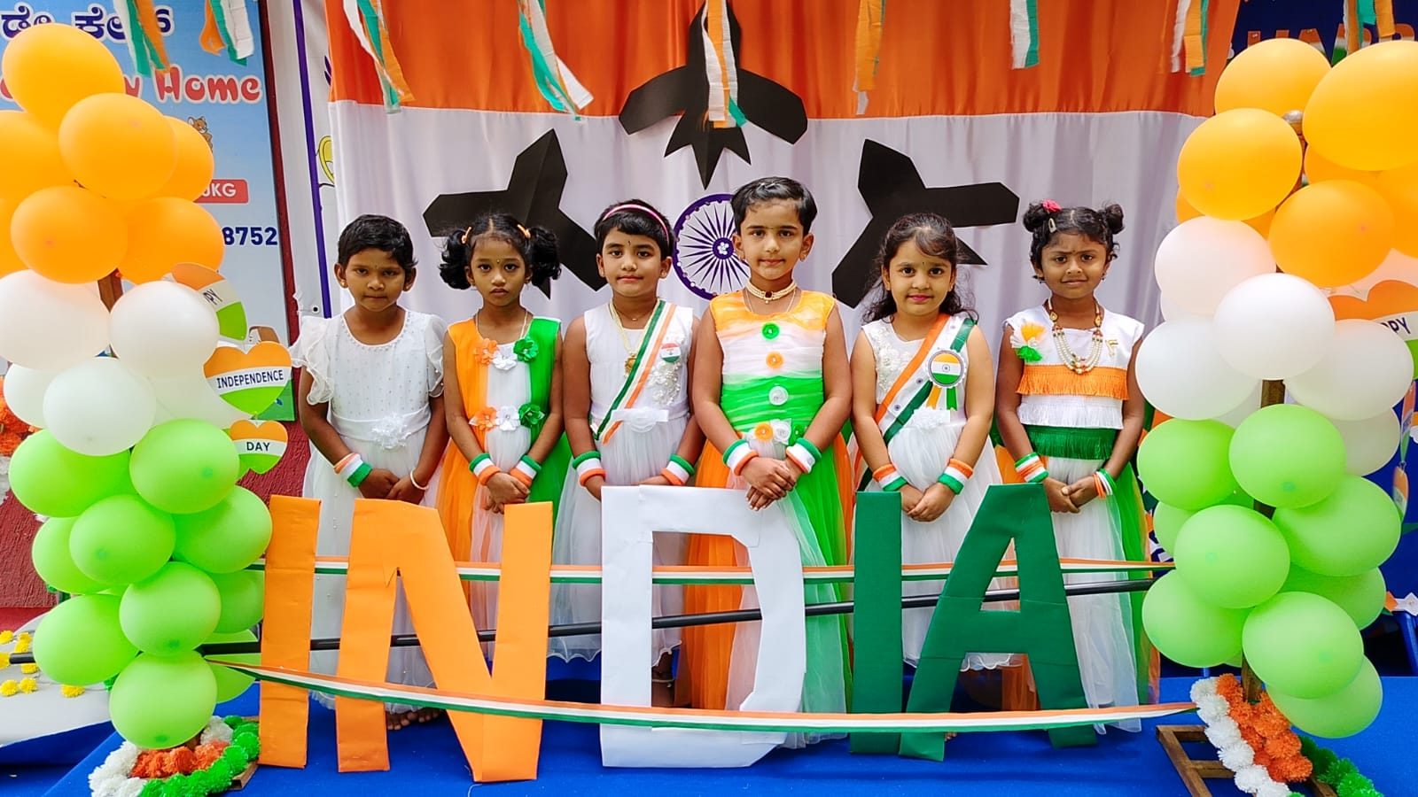 Children gathered at an Independence Day display