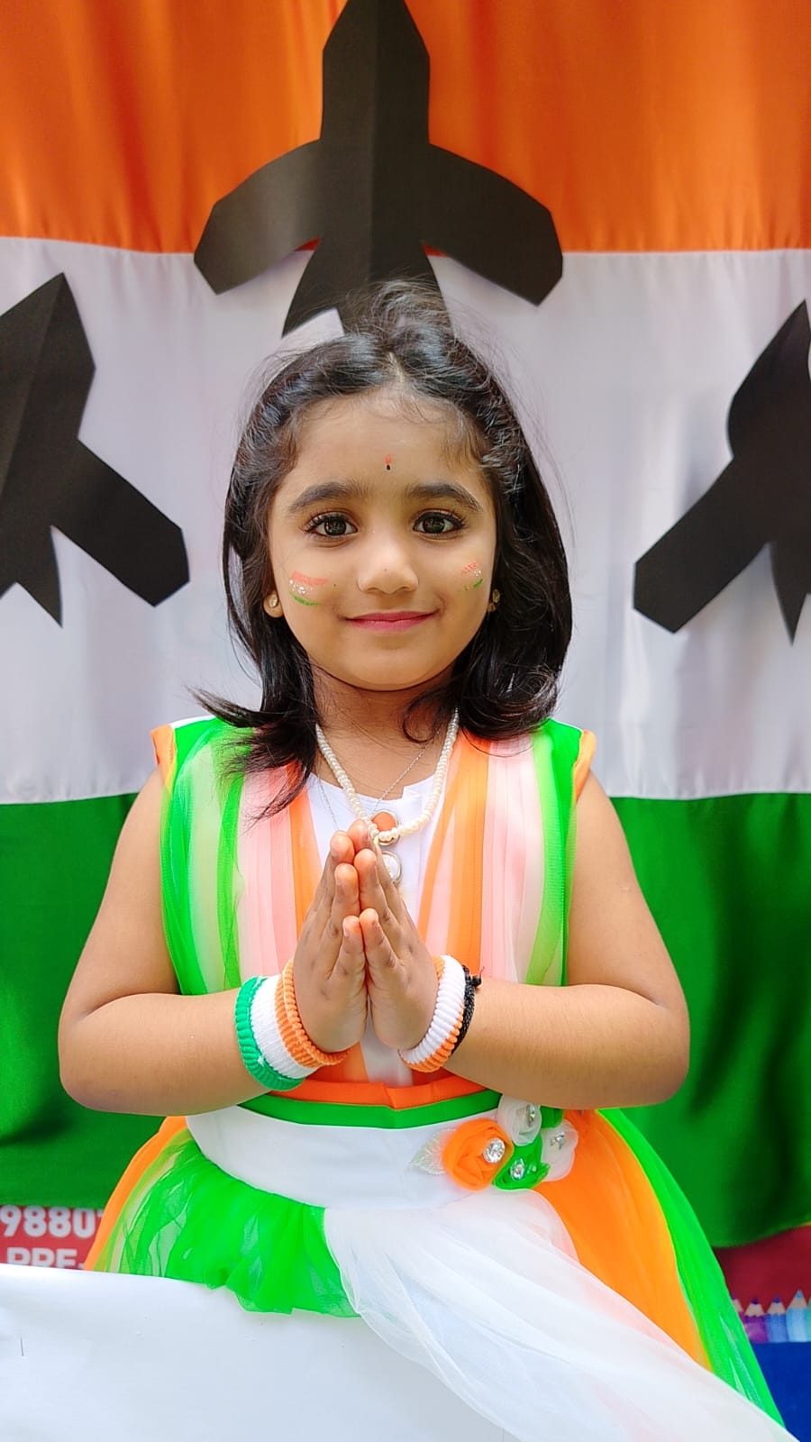 Children holding handmade tricolor fans