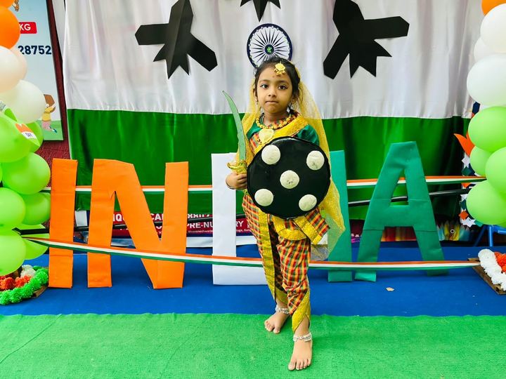 A child dressed in the Indian tricolor